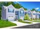 A variety of townhomes with individual garages, and various colors each with beautiful, contemporary curb appeal at 2061 Stephens Farm Dr, China Grove, NC 28023