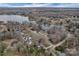 An aerial view showcasing a picturesque lakeside community with lush trees and attractive homes at 2201 Holly Ln, Shelby, NC 28150