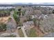 Aerial view of a home on a large lot surrounded by trees and a lake nearby at 2201 Holly Ln, Shelby, NC 28150