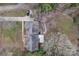 An aerial view of a well-maintained property, featuring a home with a large yard and surrounding trees at 2201 Holly Ln, Shelby, NC 28150