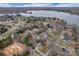 Scenic aerial view of a lakeside neighborhood with beautiful homes and abundant trees at 2201 Holly Ln, Shelby, NC 28150