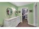 Bright bathroom features a double sink vanity with a marble countertop and walk-in closet at 2201 Holly Ln, Shelby, NC 28150