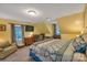 Comfortable bedroom with soft carpet, a TV, and a crib by the window at 2201 Holly Ln, Shelby, NC 28150