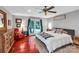 Primary bedroom with a large window, hardwood floors, and comfortable furniture at 2201 Holly Ln, Shelby, NC 28150