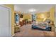 Cozy bedroom with a carpet, TV, and a crib by the window at 2201 Holly Ln, Shelby, NC 28150
