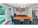 Elegant dining room with a bay window, chandelier, and hardwood floors at 2201 Holly Ln, Shelby, NC 28150
