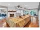 Open living room featuring fireplace, hardwood floors, ceiling fans, and sliding doors at 2201 Holly Ln, Shelby, NC 28150