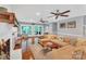 Bright living room with fireplace, hardwood floors, ceiling fans, and glass doors to the outside at 2201 Holly Ln, Shelby, NC 28150