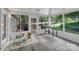 Well-lit sunroom with a view of the trees at 2201 Holly Ln, Shelby, NC 28150