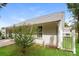 Exterior view of the backyard with a white picket fence and healthy green grass at 221 Chicago Ln, York, SC 29745