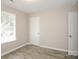 Bright bedroom featuring wood-look flooring and a window letting in natural light at 221 Chicago Ln, York, SC 29745
