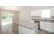 Modern kitchen featuring granite countertops, stainless steel appliances, island, and sliding glass doors at 221 Chicago Ln, York, SC 29745