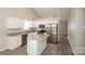 Contemporary kitchen featuring stainless steel appliances, granite countertops, white cabinets, and center island at 221 Chicago Ln, York, SC 29745