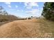 Large, open backyard with potential for various outdoor activities, complementing the property's overall appeal at 24253 Old Aquadale Rd, Albemarle, NC 28001