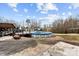 Backyard view showing an above ground pool and a deck perfect for outdoor enjoyment at 24253 Old Aquadale Rd, Albemarle, NC 28001