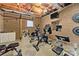 Basement home gym features workout equipment, mirrors, and wood-paneled walls at 24253 Old Aquadale Rd, Albemarle, NC 28001