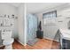 Bright bathroom with a toilet, shower featuring a patterned curtain, and a vanity at 24253 Old Aquadale Rd, Albemarle, NC 28001