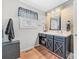 Well-lit bathroom showcasing a vanity with a modern sink and decorative accents at 24253 Old Aquadale Rd, Albemarle, NC 28001