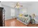 Bright bedroom with hardwood floors, neutral walls, and a cozy daybed at 24253 Old Aquadale Rd, Albemarle, NC 28001