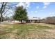Charming single-story home with a metal roof and a covered front porch at 24253 Old Aquadale Rd, Albemarle, NC 28001
