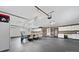 Clean garage with multiple garage doors, bright lighting, and dining and storage at 24253 Old Aquadale Rd, Albemarle, NC 28001