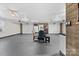 Spacious garage featuring multiple doors, high ceilings, and ample room for dining at 24253 Old Aquadale Rd, Albemarle, NC 28001