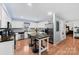 Bright kitchen with stainless steel appliances, breakfast bar, and white cabinetry at 24253 Old Aquadale Rd, Albemarle, NC 28001