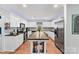 Spacious kitchen featuring stainless appliances, an island with bar stools, and ample cabinetry at 24253 Old Aquadale Rd, Albemarle, NC 28001