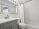 Bathroom with shower/tub, vanity with grey cabinets and silver hardware, and matching mirror at 259 Unionville Indian Trail W Rd, Indian Trail, NC 28079