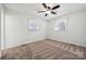 Cozy bedroom with neutral carpet and ceiling fan for added comfort at 259 Unionville Indian Trail W Rd, Indian Trail, NC 28079