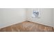Bright bedroom with neutral carpet, white walls, and natural light from the window at 259 Unionville Indian Trail W Rd, Indian Trail, NC 28079