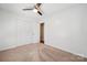 Bedroom with neutral carpet, ceiling fan, and a closet for storage at 259 Unionville Indian Trail W Rd, Indian Trail, NC 28079