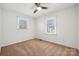 Bedroom offering natural light, neutral carpet, and a ceiling fan at 259 Unionville Indian Trail W Rd, Indian Trail, NC 28079