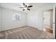 Inviting bedroom featuring a ceiling fan, closet, and ample natural light at 259 Unionville Indian Trail W Rd, Indian Trail, NC 28079