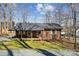 Charming brick home featuring a covered porch with a swing and well-maintained landscaping at 259 Unionville Indian Trail W Rd, Indian Trail, NC 28079