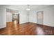 Spacious room featuring hardwood floors and a white brick wall that adds character at 259 Unionville Indian Trail W Rd, Indian Trail, NC 28079