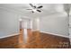 Inviting living room with hardwood floors, flowing into a modern kitchen with stainless steel appliances at 259 Unionville Indian Trail W Rd, Indian Trail, NC 28079