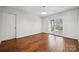 Living area boasts hardwood floors and sliding glass doors leading to a deck at 259 Unionville Indian Trail W Rd, Indian Trail, NC 28079