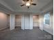 Large main bedroom with a ceiling fan and two walk-in closets with shelving at 283 Luray Way # 449, Rock Hill, SC 29730