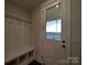 Functional mudroom with built-in bench and storage, with a glass door leading to the outside at 283 Luray Way # 449, Rock Hill, SC 29730