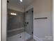 Contemporary shower with tiled walls, a glass door, and a built-in bench at 283 Luray Way # 449, Rock Hill, SC 29730