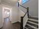 Elegant staircase with dark wood treads and white risers complemented by stylish wood railing at 283 Luray Way # 449, Rock Hill, SC 29730