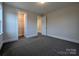 Bright bedroom features soft neutral paint, carpet and base trim at 287 Luray Way # 450, Rock Hill, SC 29730