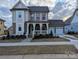 Charming two-story home with a welcoming front porch and well-manicured lawn in a cozy community at 287 Luray Way # 450, Rock Hill, SC 29730