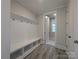 Welcoming mudroom with ample storage and coat hooks for organization at 287 Luray Way # 450, Rock Hill, SC 29730
