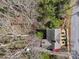 Overhead view of a home with a landscaped yard surrounded by mature trees at 311 3Rd Avenue Se Dr, Hickory, NC 28602