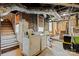 Basement laundry area with exposed brick, washer, dryer and concrete floors at 311 3Rd Avenue Se Dr, Hickory, NC 28602