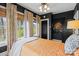 Bright bedroom with a patterned bedspread, windows, and dark walls at 311 3Rd Avenue Se Dr, Hickory, NC 28602
