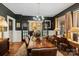 Elegant dining room featuring a large table, hardwood floors, and stylish decor at 311 3Rd Avenue Se Dr, Hickory, NC 28602