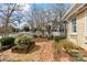 Landscaped front yard features brick path and a white picket fence at 311 3Rd Avenue Se Dr, Hickory, NC 28602